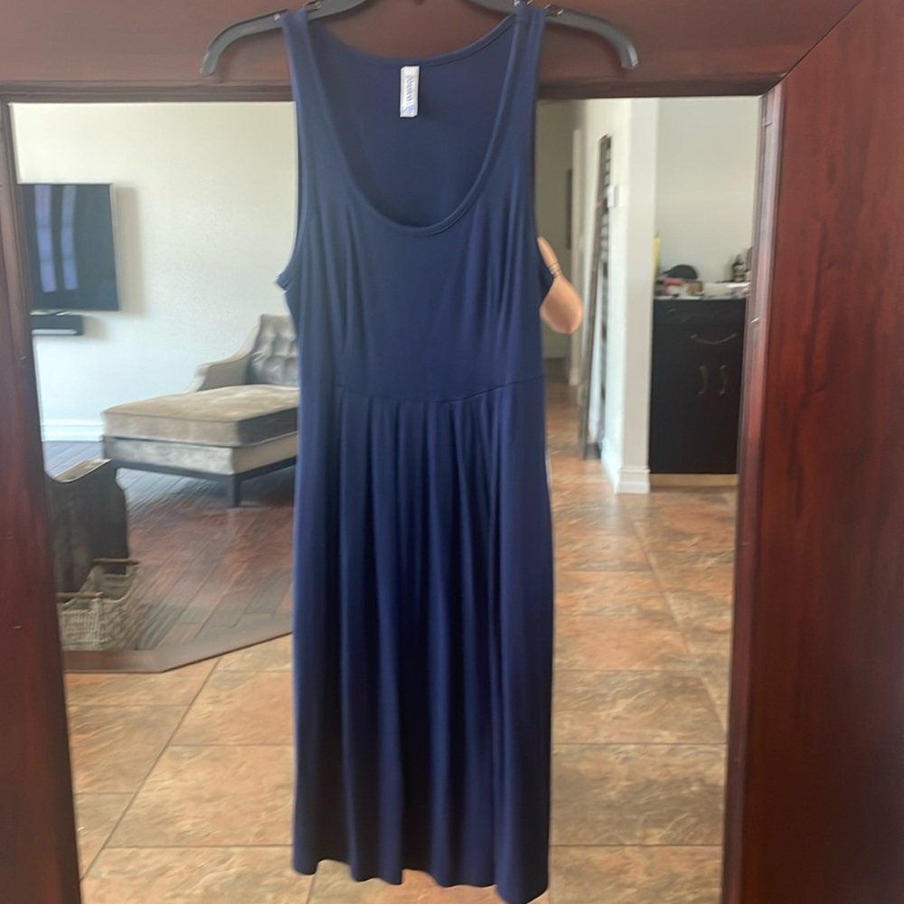 Gorgeous navy blue midi dress with pockets .